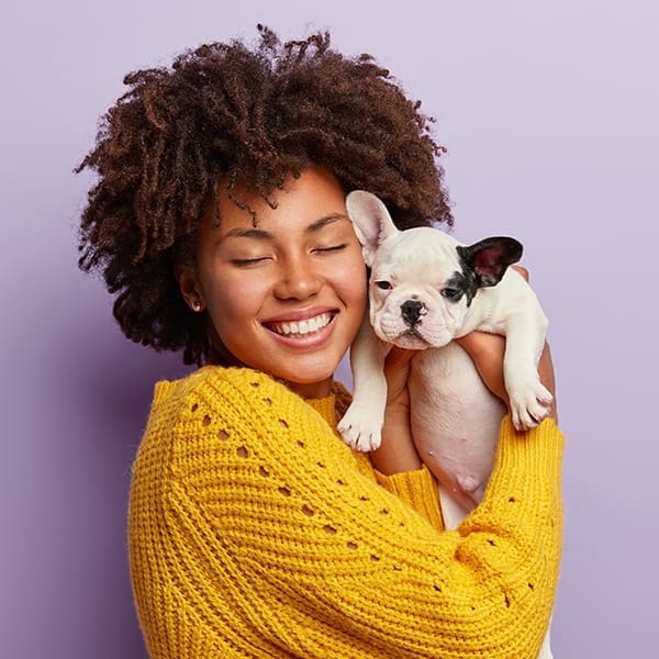 Woman Holding Frenchie Puppy